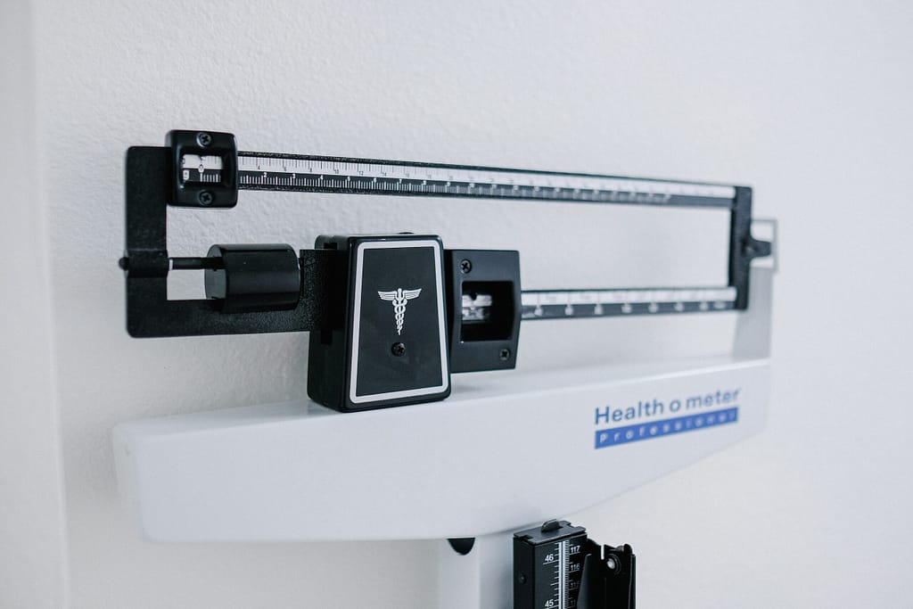 a scale against a white wall